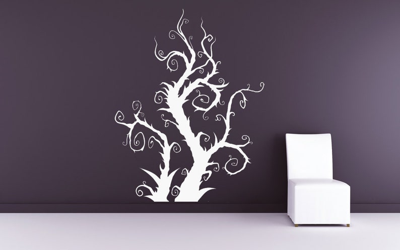 Window tree decal showing a bold vertical silhouette with curling branches that creates a striking visual statement when applied to glass surfaces.