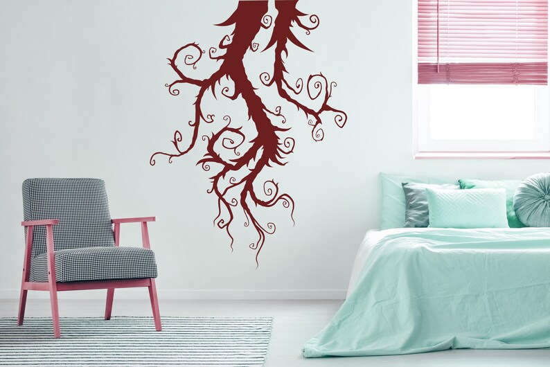 Artistic tree silhouette featuring flowing lines and curling branches that give a sense of movement and personality rather than symmetry or realism.