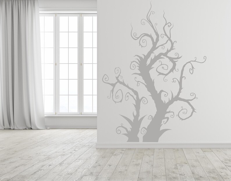 Spooky tree wall decal with twisting branches that stretch upward in an unusual organic form, blending gothic, fantasy, and artistic decor styles.