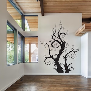 Curly branch decor designed with layered, swirling limbs that feel pulled from a fairytale illustration or fantasy sketch. Whimsical silhouette of a tree with twisting branches and swirling vines. The tree is a wall decal and is a great way to add a touch of whimsy to any room.
