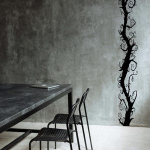 Spooky tree wall decal displays a twisting vertical design that feels playful and stylized rather than literal or realistic.