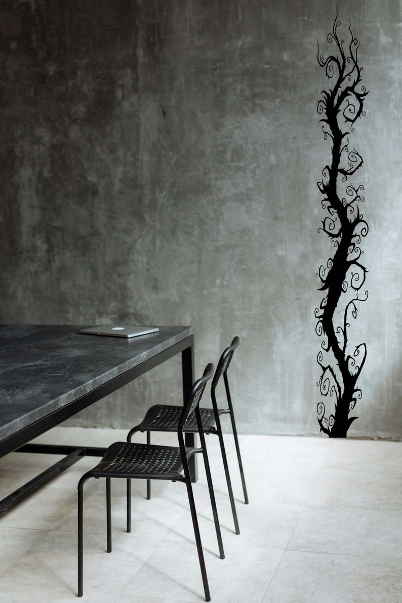Spooky tree wall decal displays a twisting vertical design that feels playful and stylized rather than literal or realistic.