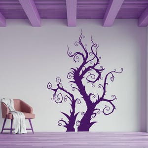 Tree branch wall decal featuring a tall twisting silhouette with curling limbs that create an eerie organic shape inspired by gothic and whimsical forest themes.