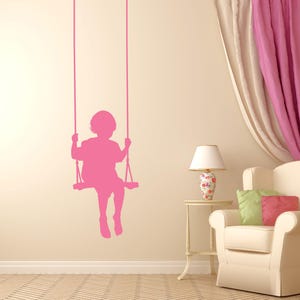 Swinging child decal in classic silhouette style, created to bring charm, warmth, and a timeless childhood mood into any decorative space.