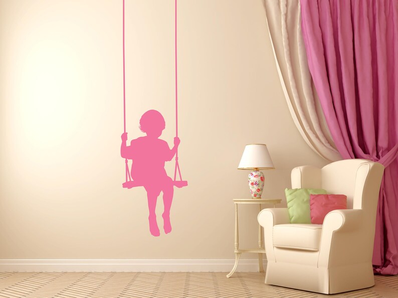 Swinging child decal in classic silhouette style, created to bring charm, warmth, and a timeless childhood mood into any decorative space.