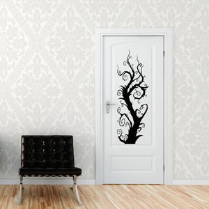Vine wall decal featuring swirling botanical forms that climb upward, making it a renter friendly way to add expressive nature art without permanence.