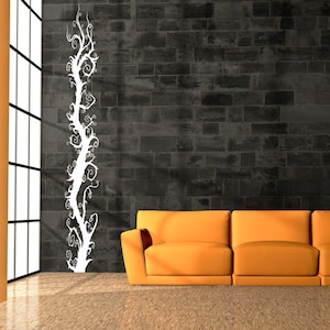 Curly branch wall decal captures an expressive tree form with looping branches that feel animated and detailed without overwhelming the space.