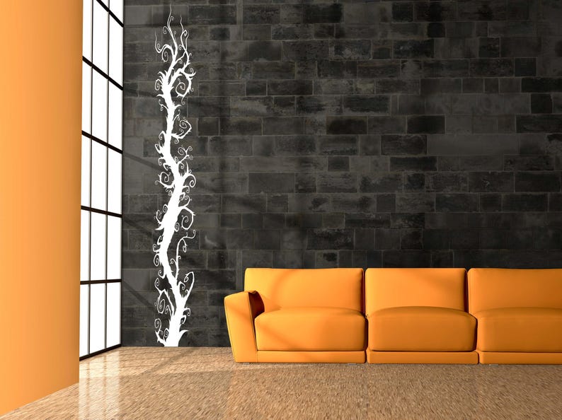 Curly branch wall decal captures an expressive tree form with looping branches that feel animated and detailed without overwhelming the space.