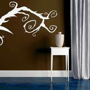 Renter-friendly branch wall decal designed for easy removal, with curling gothic vines that add instant mood and style without commitment.