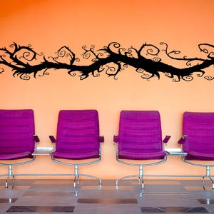 Fantasy tree wall art stretches upward with winding lines, creating the sense of motion and growth frozen in a single striking form.