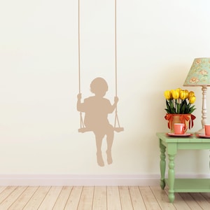 Child swing stencil decal with a gentle silhouette design, offering a touch of childhood magic and a peaceful reminder of simple moments that stay with us.