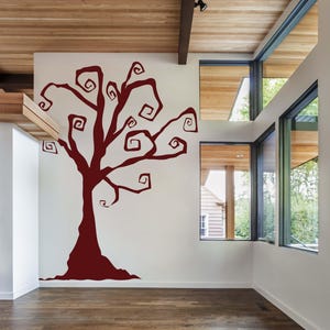 Haunted house wall art with stylized swirling tree branches for eerie seasonal charm.