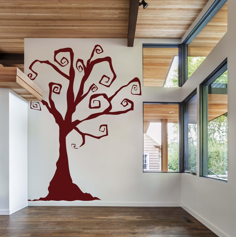 Haunted house wall art with stylized swirling tree branches for eerie seasonal charm.