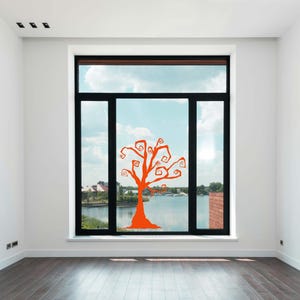 Halloween decoration with whimsical swirling tree branches for spooky window or wall display.