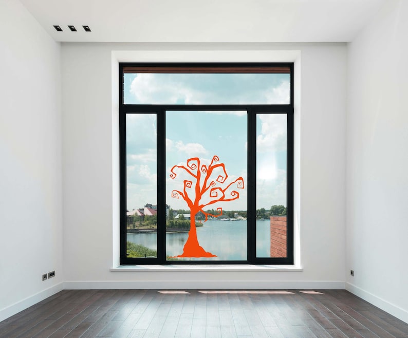 Halloween decoration with whimsical swirling tree branches for spooky window or wall display.
