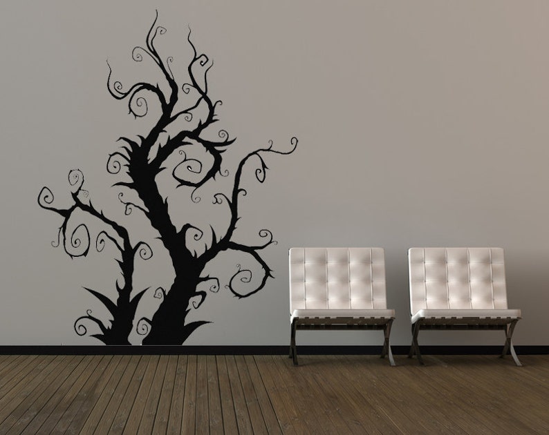 Tree wall decal for renters designed as a removable silhouette that adds dramatic visual interest without permanent changes to the wall surface.