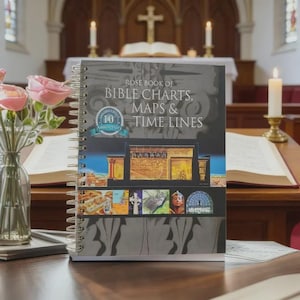 May include: A spiral-bound book titled "Rose Book of Bible Charts, Maps & Time Lines" with a colorful cover featuring illustrations of ancient architecture and figures. The book is open on a wooden surface, with a church interior in the background.