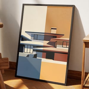 Puede incluir: Impresión enmarcada de un diseño de casa moderna, con formas geométricas y una paleta de colores apagados. La obra de arte utiliza azul, marrón y beige. La impresión está en un marco negro.