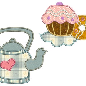 May include: An embroidered design featuring a teapot with a pink heart and a cupcake with a donut. The teapot is light blue with a plaid pattern and the cupcake has pink frosting with purple dots. The donut is golden yellow.