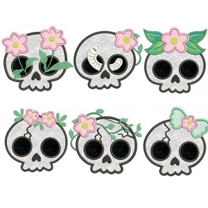 May include: Six cartoon skulls with floral and leaf accents. The skulls are white with black eye sockets and noses. Some skulls have pink flowers, green leaves, and a worm. The skulls are a whimsical design.
