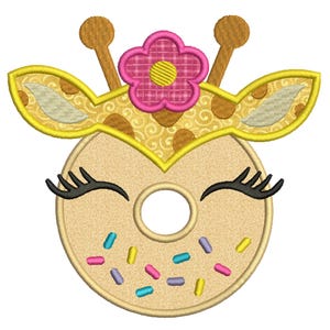 May include: A whimsical embroidered design featuring a giraffe-themed donut. The donut is tan with colorful sprinkles and black eyelashes. The giraffe has yellow ears, a flower crown, and brown antlers. This design is perfect for apparel or accessories.