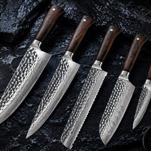 May include: A set of five kitchen knives with dark brown wooden handles and silver metal bolsters. Each blade features a distinct hammered texture on the upper portion and a sharp, smooth or serrated edge, arranged in a row from largest to smallest.