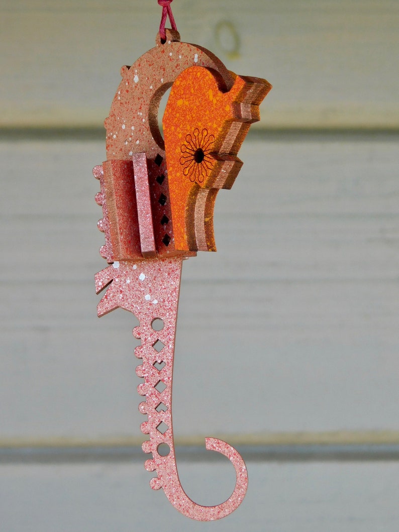 hanging seahorse decoration. laser cut / lasercut mdf red