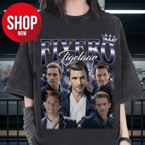 May include: Dark gray t-shirt featuring a graphic of five men with the text "FIVER Tigelaar" in a blue and white design. A red circle with the words "SHOP NOW" is in the upper left corner.