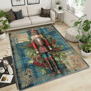 May include: A rectangular area rug with a teal background and a detailed design. The rug features a large, colorful nutcracker figure surrounded by pine needles, berries, and pine cones. The rug has a vintage, distressed look.
