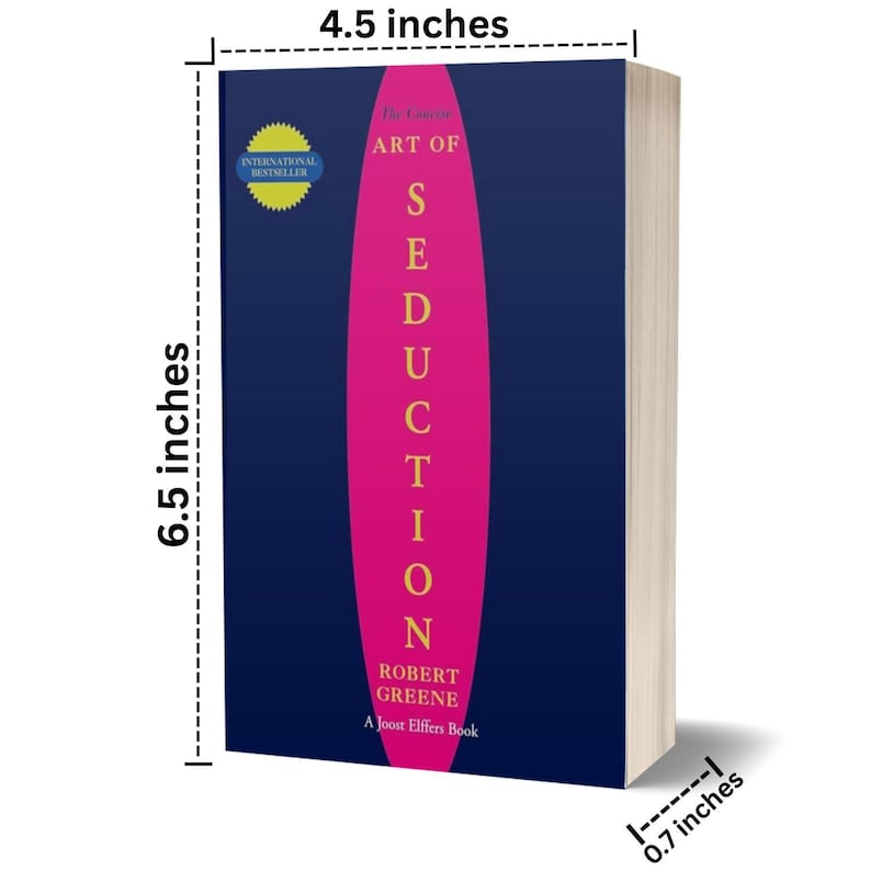May include: A hardcover book titled "The Art of Seduction" by Robert Greene. The book has a dark blue cover with a vertical pink stripe and the title in white. The book is 6.5 inches tall, 4.5 inches wide, and 0.7 inches thick.
