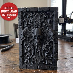 May include: A rectangular black 3D printed plaque featuring a central skull flanked by two smaller skulls, surrounded by intricate scrollwork and a brick-patterned border. The image includes a red circular badge stating DIGITAL DOWNLOAD NOT physical item.