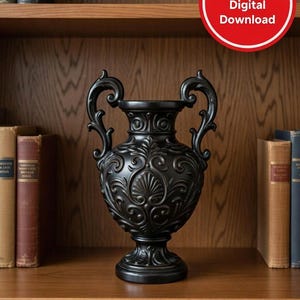 May include: Black decorative vase with ornate scrollwork and handles. The vase has a wide base and a detailed design. The vase is displayed on a wooden shelf with books in the background. The image includes a red circle with the text "NO shipping Digital Download".