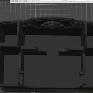 May include: A matte black desk organizer featuring multiple compartments of varying sizes for storage. The back panel displays a decorative embossed rose motif. The text Bambu Textured PEI Plate is visible on the left side of the base surface.
