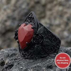 May include: Black ring with a faceted red heart-shaped stone. The ring features intricate floral and leaf detailing, with roses on the sides. The ring has a gothic or romantic aesthetic.
