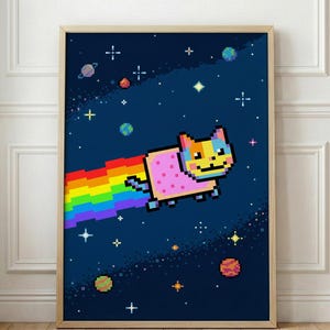 May include: A framed print featuring a pixelated cat with a rainbow trail, set against a dark blue space background with stars and planets. The cat has a pink body and a yellow, blue, and orange face. The artwork is displayed in a wooden frame.