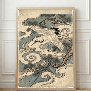 May include: Framed print of a Japanese crane in flight. The artwork features a white crane with black wingtips and a red head, set against a backdrop of swirling blue clouds and pine branches. The print has a vintage aesthetic.