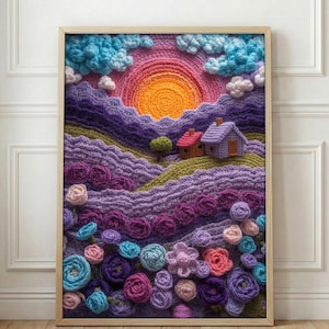 May include: A framed, colorful crochet landscape art piece. The artwork depicts a sunset over rolling hills with houses, flowers, and clouds. The color palette includes shades of purple, pink, orange, blue, and green.