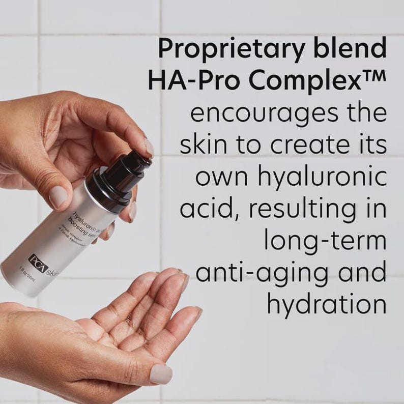 May include: A silver PCA Skin hyaluronic acid boosting serum bottle with a black pump is held in a person's hands. The text on the bottle reads "hyaluronic acid boosting serum". The text on the right side of the image reads "Proprietary blend HA-Pro Complex encourages the skin to create its own hyaluronic acid, resulting in long-term anti-aging and hydration."