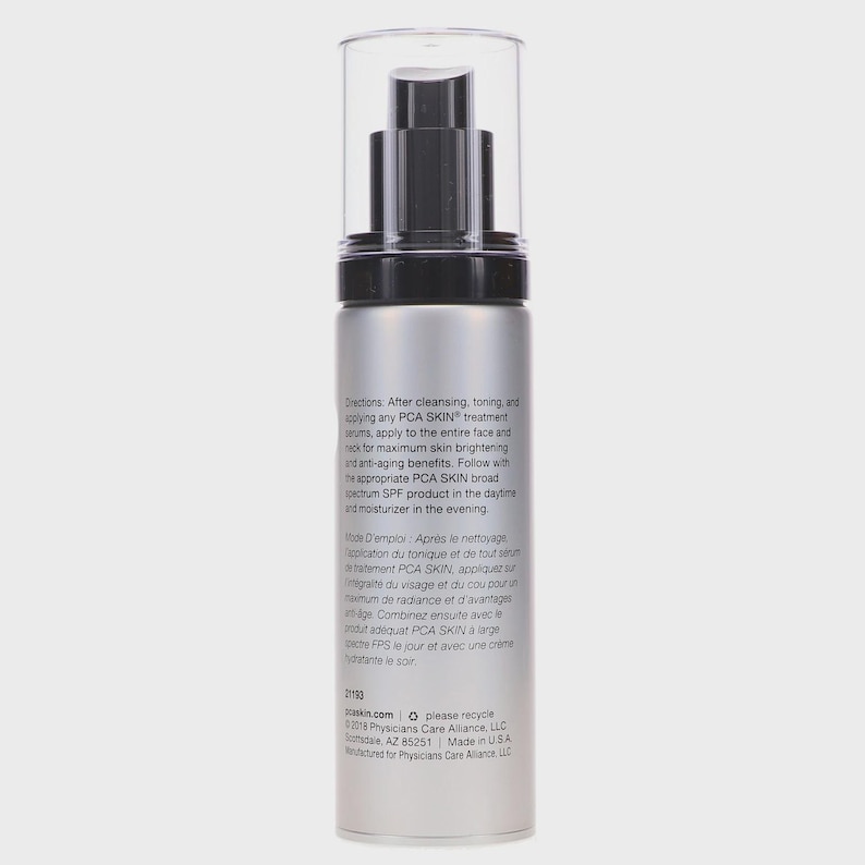 May include: A silver and black PCA SKIN treatment bottle with a clear plastic cap. The bottle has a pump dispenser and contains text in English and French. The text describes the product's use for skin brightening and anti-aging benefits.