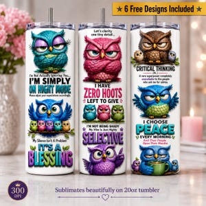 May include: Three white cylindrical tumblers with lids, each featuring colorful cartoon owl illustrations and text. The designs include phrases like 'I'm simply on night mode', 'I have zero hoots left to give', and 'I choose peace every morning'.