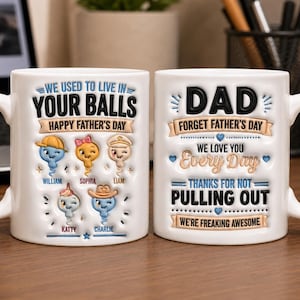 May include: Two white ceramic mugs featuring raised text and cartoon illustrations. The first mug reads WE USED TO LIVE IN YOUR BALLS HAPPY FATHER'S DAY with five illustrated sperm characters labeled William, Sophia, Liam, Katty, and Charlie. The second mug reads DAD FORGET FATHER'S DAY WE LOVE YOU Every Day THANKS FOR NOT PULLING OUT WE'RE FREAKING AWESOME.