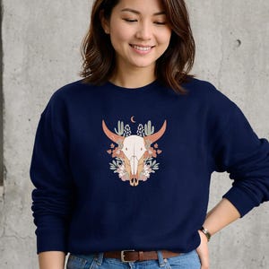 May include: A white ceramic mug with a black handle and the text "But First, Coffee" in a handwritten style. The mug is on a white surface. The mug is approximately 4 inches tall.