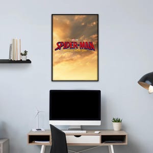 May include: A framed rectangular wall poster featuring a golden sunset sky background with the red and blue text Spider-Man Brand New Day and the Marvel Studios logo centered in the upper portion of the print, displayed in a black frame.