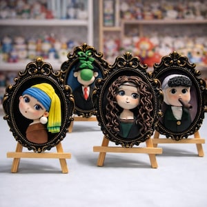 May include: Four framed miniature portraits on small wooden easels. The portraits feature cartoon-like renditions of famous figures, including a woman with a yellow headscarf, a man with a green hat, a woman with curly brown hair, and a man with a white wig.