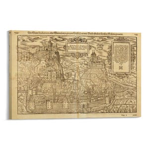 May include: A black and white historical map print titled Die Statt Sedunum oder Sitten sampt zweyen Schlössern und Bischofflichen Kirchen Valeria genannt. The illustration depicts a fortified city with two prominent castles on hills, detailed buildings, walls, and two text boxes with German inscriptions.