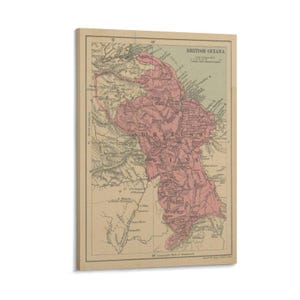 May include: Vintage map print of British Guiana, featuring a detailed cartographic representation in shades of pink and beige. The map includes geographical features and text, mounted on a wooden frame, offering a historical aesthetic.
