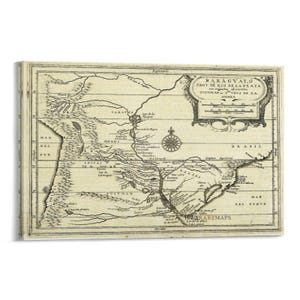 May include: A vintage map print of Paraguay and the Rio de la Plata region, featuring detailed geographical illustrations and text. The map is framed and has a sepia tone, with the title "PARAGVAYO PROV DE RIO DE LA PLATA" visible.