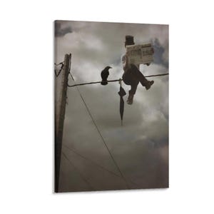 May include: A canvas print depicts a surreal scene of a person reading a newspaper while perched on a power line, with a crow nearby. An open umbrella hangs below. The background is a cloudy sky.