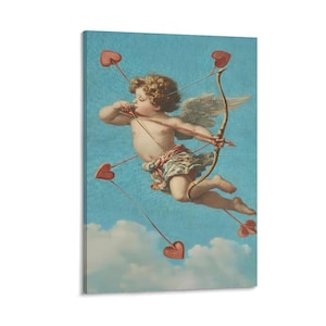 May include: A canvas print of a classical painting featuring a cherubic angel with wings, aiming a bow and arrow. The angel is surrounded by red heart-shaped arrows against a blue sky with clouds. The artwork evokes themes of love and romance.