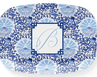 May include: A white rectangular serving tray with a blue and white floral pattern. The center of the tray features a white square with a blue letter "B" in a script font.